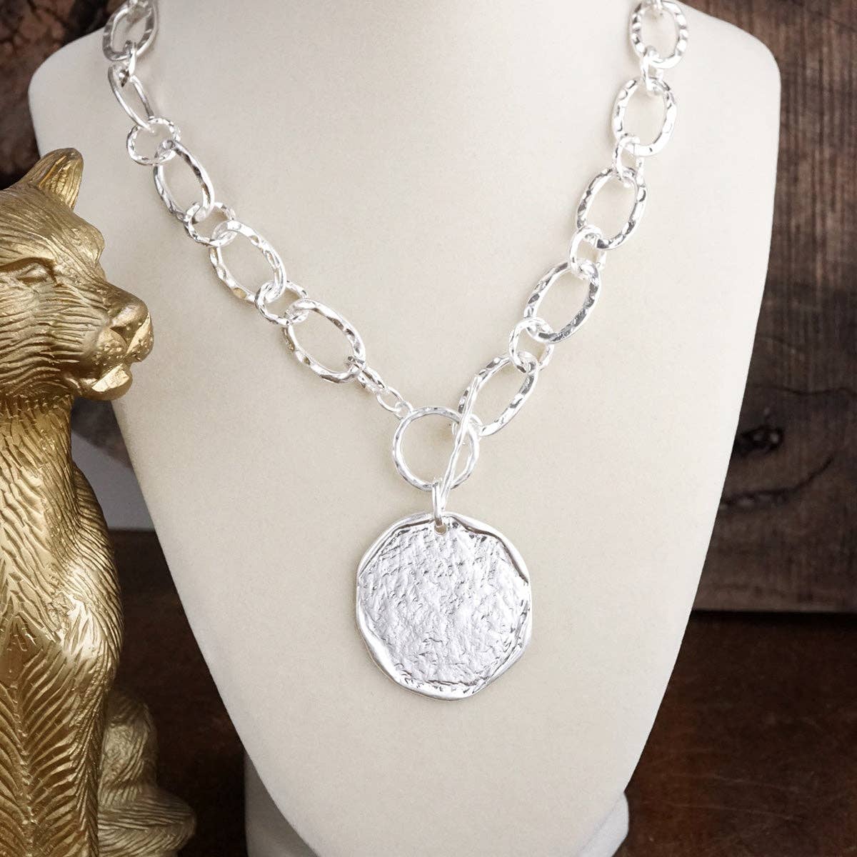 Nomad Glow – Front Toggle Statement Necklace with Hammered Disc: Worn Silver Tone