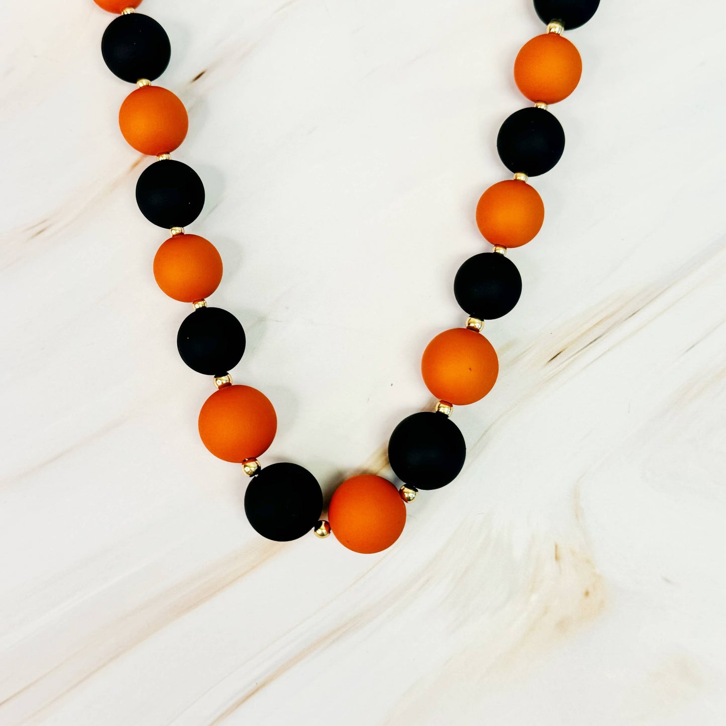 Champion Of The Game Ball Bead Necklace: Red/Black