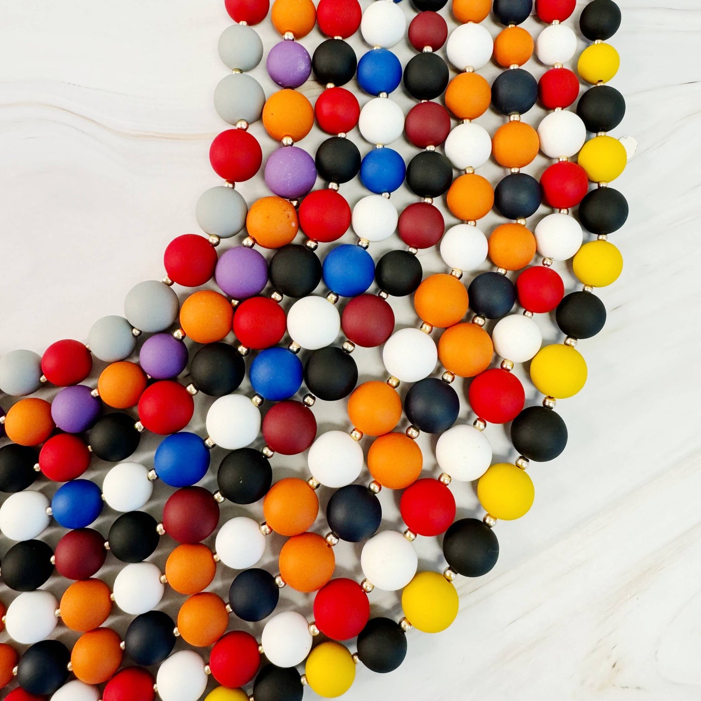Champion Of The Game Ball Bead Necklace: Orange/Purple