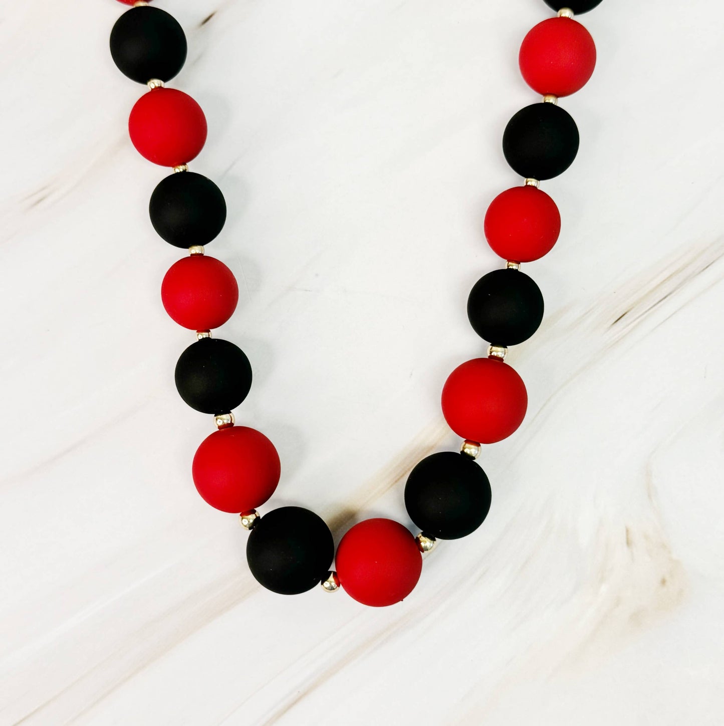 Champion Of The Game Ball Bead Necklace: Orange/Purple
